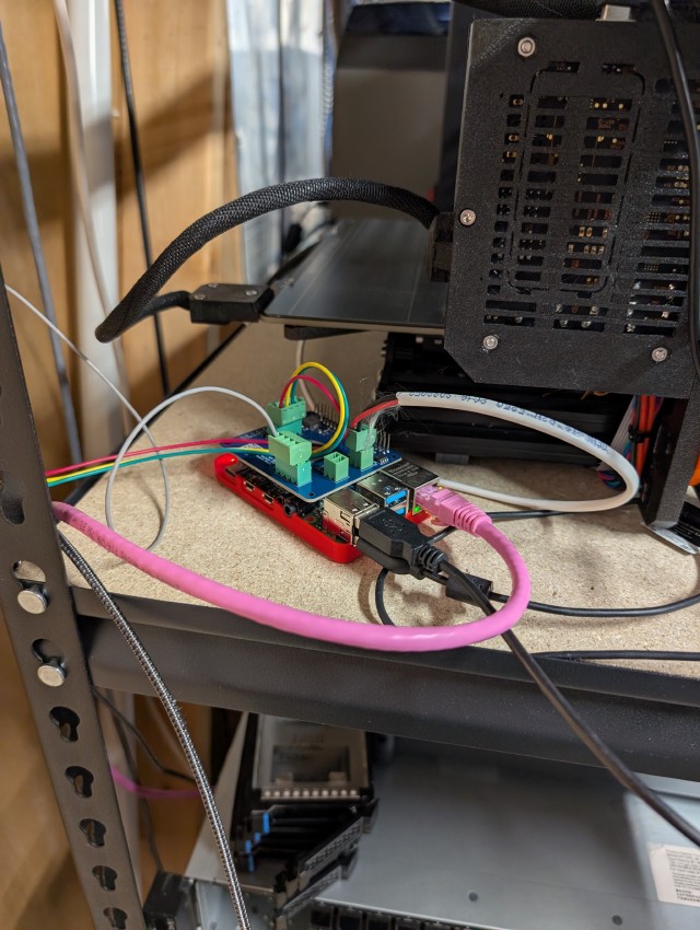 Hat on a Pi with wires coming out of it, connected to my printer